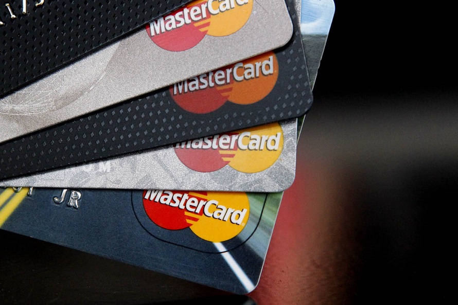 FILE - In this Thursday, April 25, 2013, file photo, MasterCard credit cards are displayed for a photographer in Montpelier, Vt. MasterCard Inc. reports quarterly financial results before the market opens on Thursday, Oct. 31, 2013. (AP Photo/Toby Talbot, File)